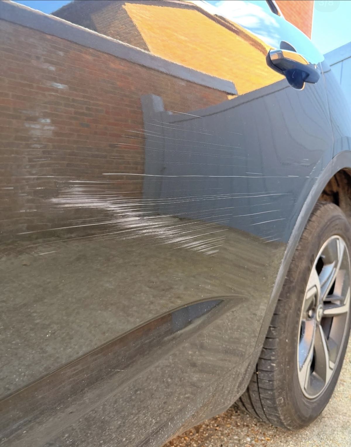 Jaguar F-Pace rear door scratch before repair
