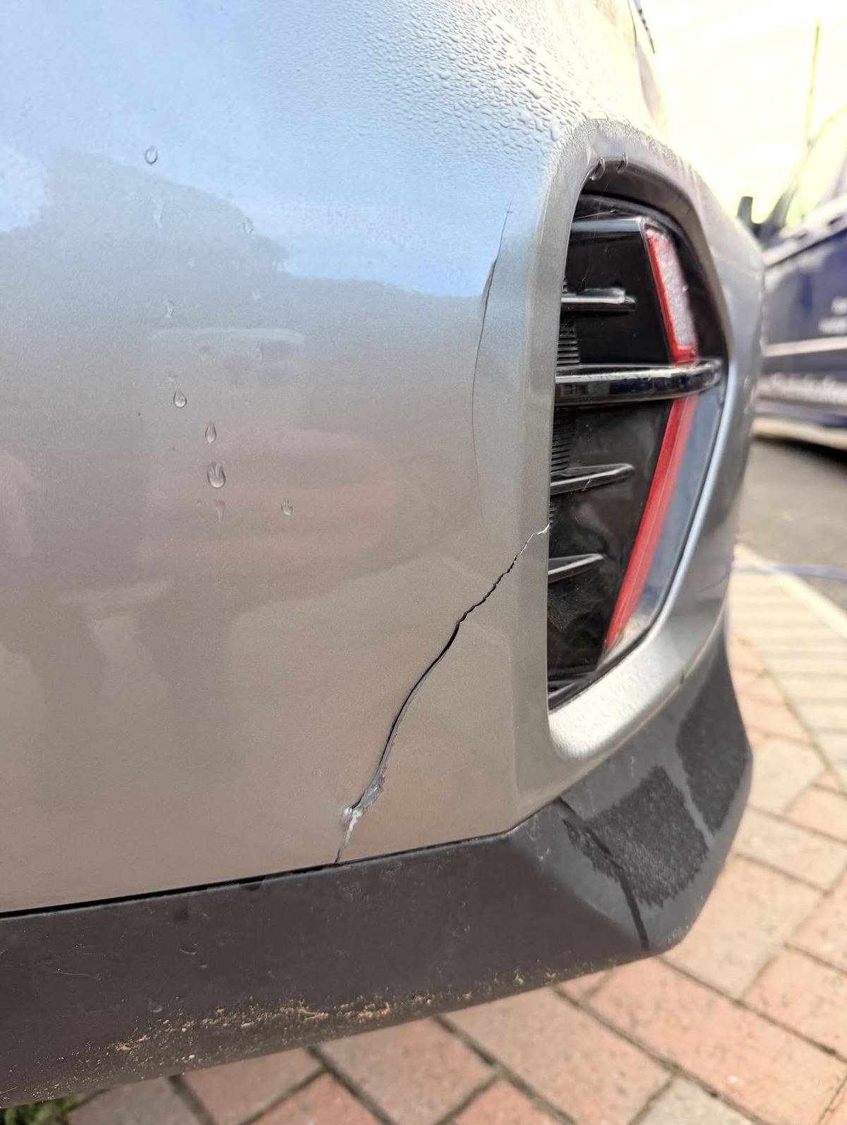 Kia silver rear bumper before repair - split crack, Guildford