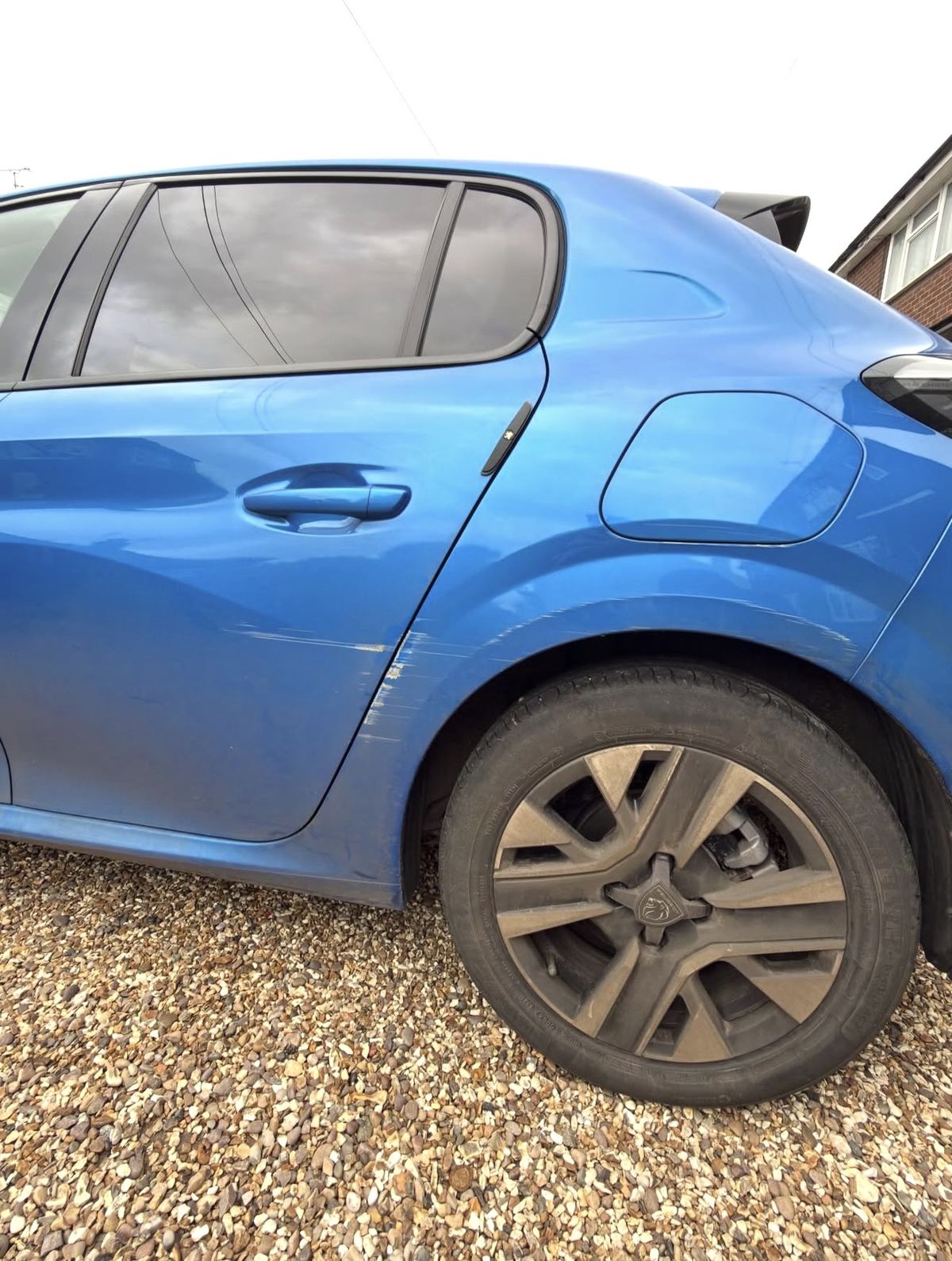 Peugeot door scratch before repair
